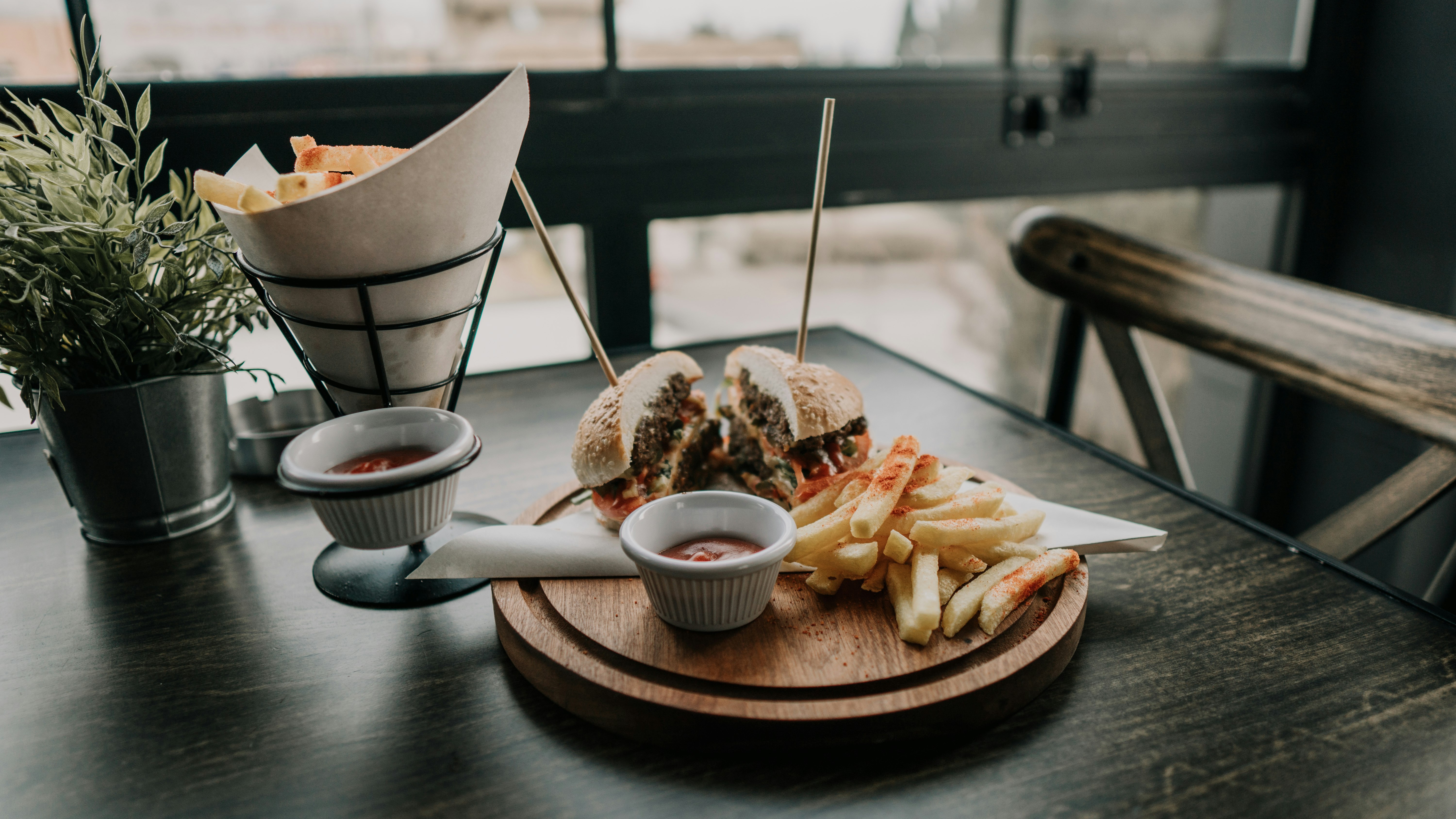 cooked burger and fries with dips